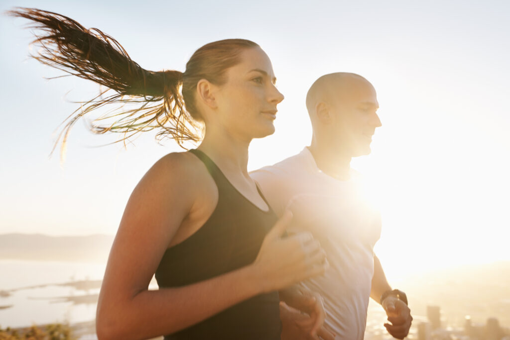 sunrise wellness running couple doing workout morning exercise health fitness together sport marathon woman runner run with man athlete training cardio sports energy